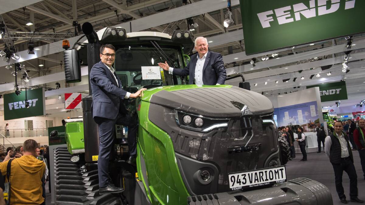 Fendt, vice president marketing, Roland Schmidt and vice president and chairman of the Fendt Management board, Peter-Josef Paffen accept the 2018 Machine of the Year - Tractors XXL award