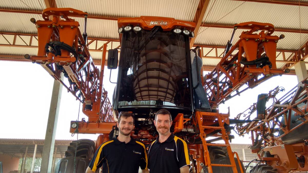  FarmscanAg software developer David Hammond and director Jason Stone checking out a self-propelled sprayer in Brazil using the company’s AgGuide V5 software engine and customer-developed user interface.