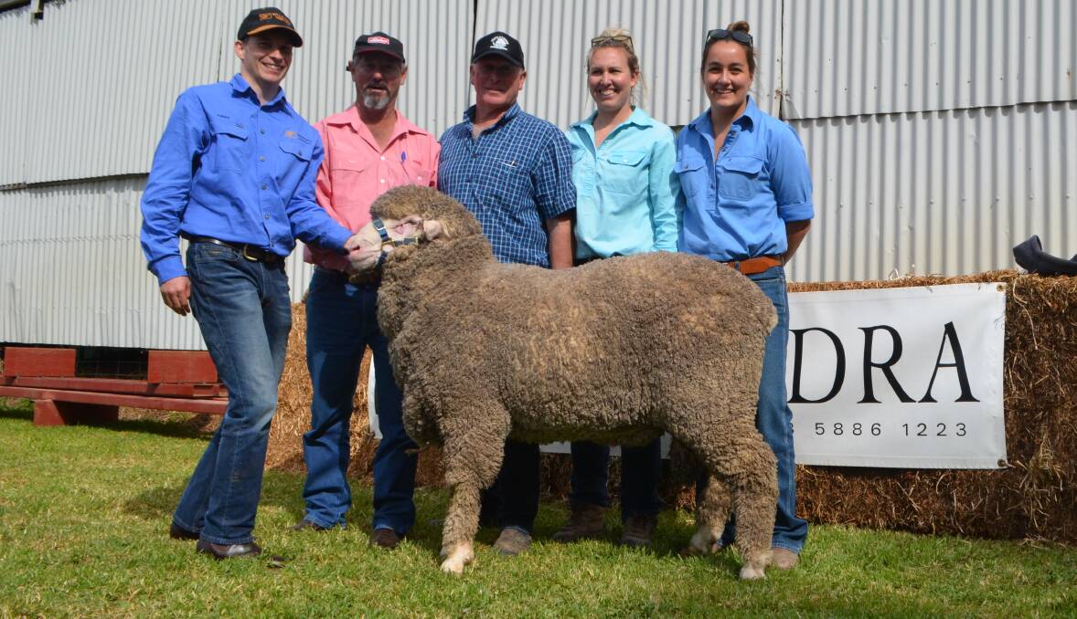 $22,000 sire: Ashley Heath, Willandra Merinos, Jerilderie, with Mark Newnham, Elders, Hay, Doug and Dimity Comb, Hay, and Stephanie Birk. Mr Comb was buying from Willandra for the first time.