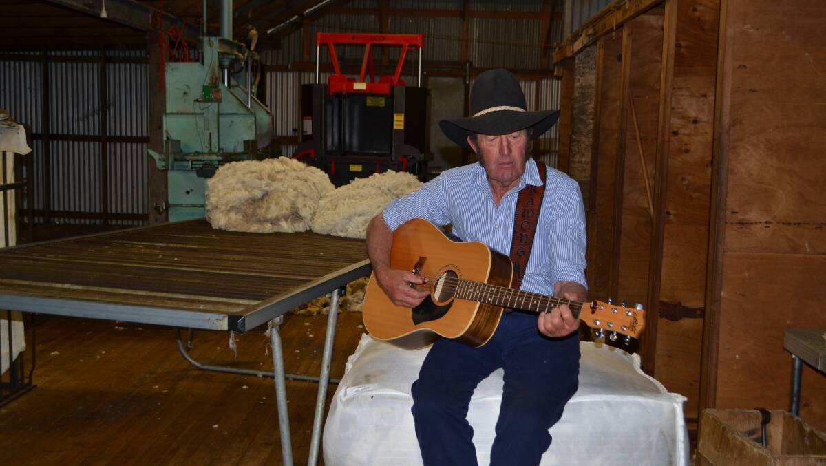 In his woolshed, Ernie Constance is lost in reverie as he sings his latest song "Milestones" in honour of his wife Deb and his mates. 