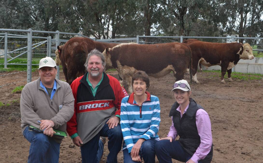 Ian Locke, with Ray and Michele Cheers, with their daughter Megan Groat. Return clients Mr and Mrs Cheers purchased Wirruna Kingfish K145 for top price of $16,000 to continue the improvement of their herd. 