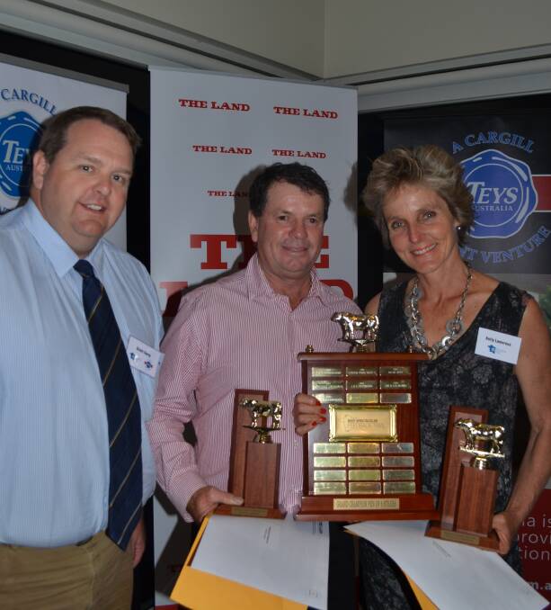 Teys Australia general manager feedlots, Grant Garey, presents Rob and Kelly Lamoureux, Armidale, with the champion and reserve pen of five steers awards.  
