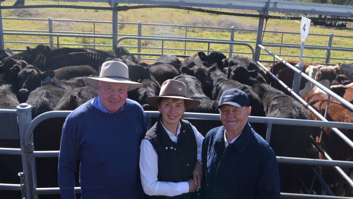 Jim Renshaw, manager Bundarbo Station, Jugiong, with station principals Sue and Sam Chisholm, with their pen of  60 Angus steers, spring drop, which sold for $1050, up $120 on last year.