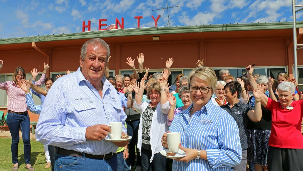 Happy volunteers: HMFD’s Ross Edwards and Belinda Anderson celebrate with volunteers from community groups the funds generated by the 2016 field days. Photo: Kim Wood.