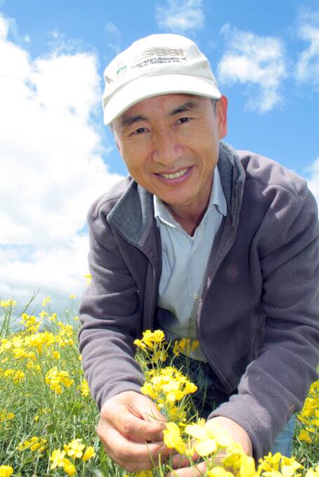 Soil research: NSW DPI principal research scientist and project leader, Dr Guangdi Li, said this field trial is exploring novel treatments to address the effects of subsoil acidity.  In its first year researchers are seeing clear responses to deep placement of lime and organic soil amendments. Photo: supplied.
