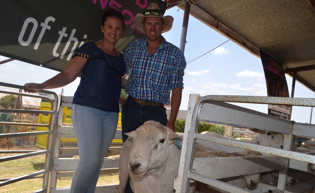 Phillipa and Daniel Jones, "Needlewood", Condobolin with one of the two rams they paid $3250 for in the draft of six rams which avergaed $2792.