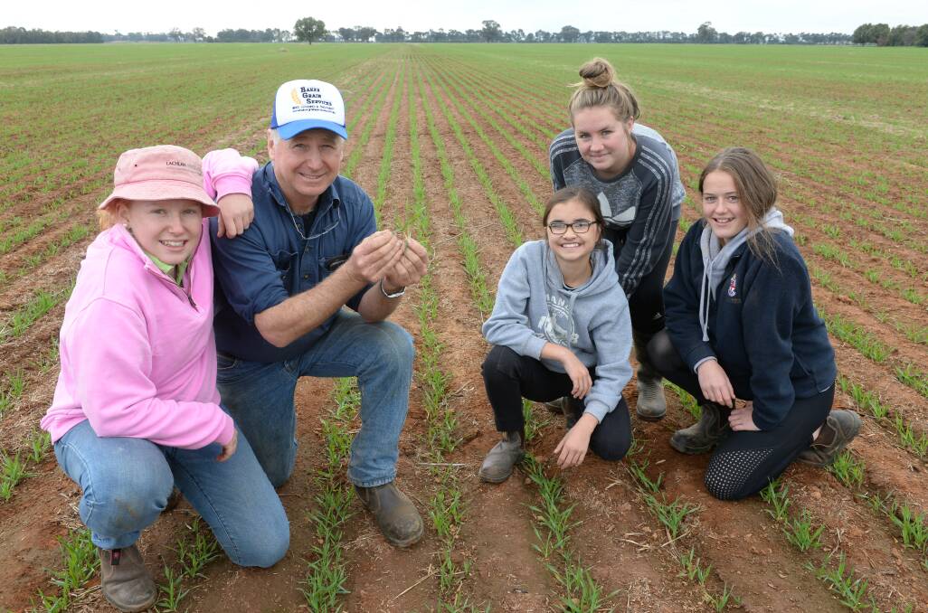 Alex and Rob Johnson, "Clavering", Grenfell looking at the growth of barley sown 10 May with Lizzie Backhouse, Sydney and year nine exchange students from New Zealand, Sophie McVerry and Demi Hermansen.

