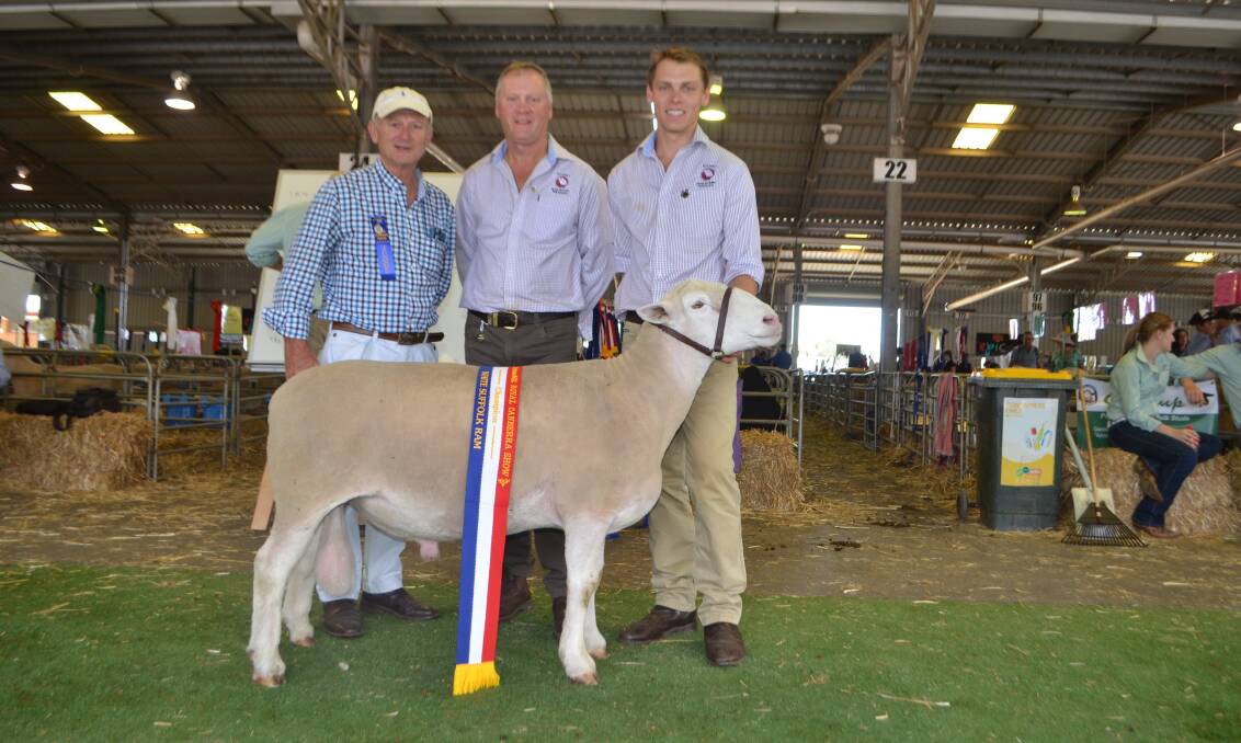 Judge Peter Matus, with Brett and Cameron Picker, Rocdell White Suffolks, Bigga with their champion White Suffolk ram. It went on to be judged the supreme prime lamb ram exhibit.