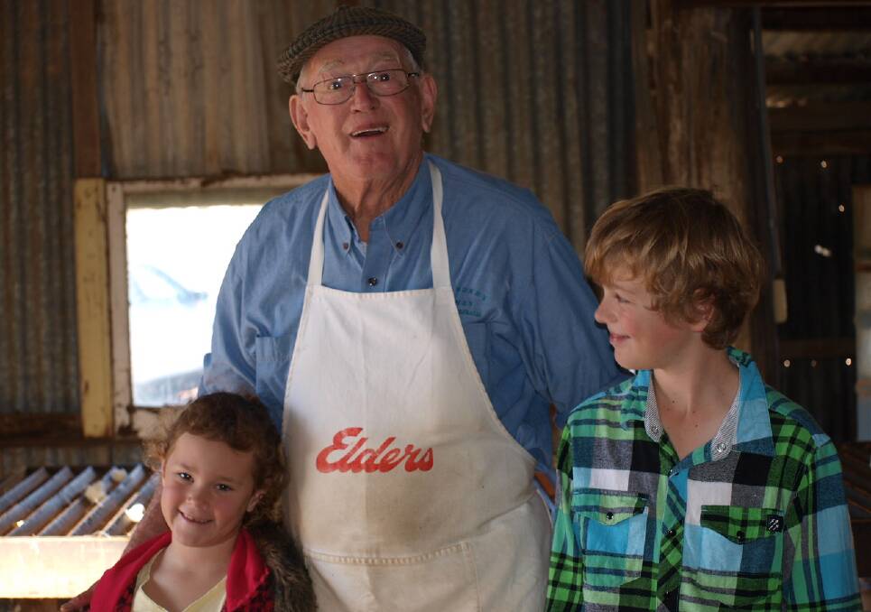 Wool classer: Alan Curtis, with his grandchildren, Gemma and Jarrod Thomas. Photo: provided by Alan Curtis, junior.