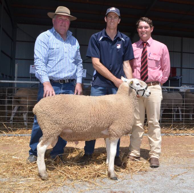With his top priced purcahse, Chris Hewitt, Hewitt Border Leicesters, Warracknabeal, Victoria, and Nathan Kember, Gleneith Border Leicesters, Ganmain and auctioneer, Will Stoddart, Elders, Wagga Wagga.