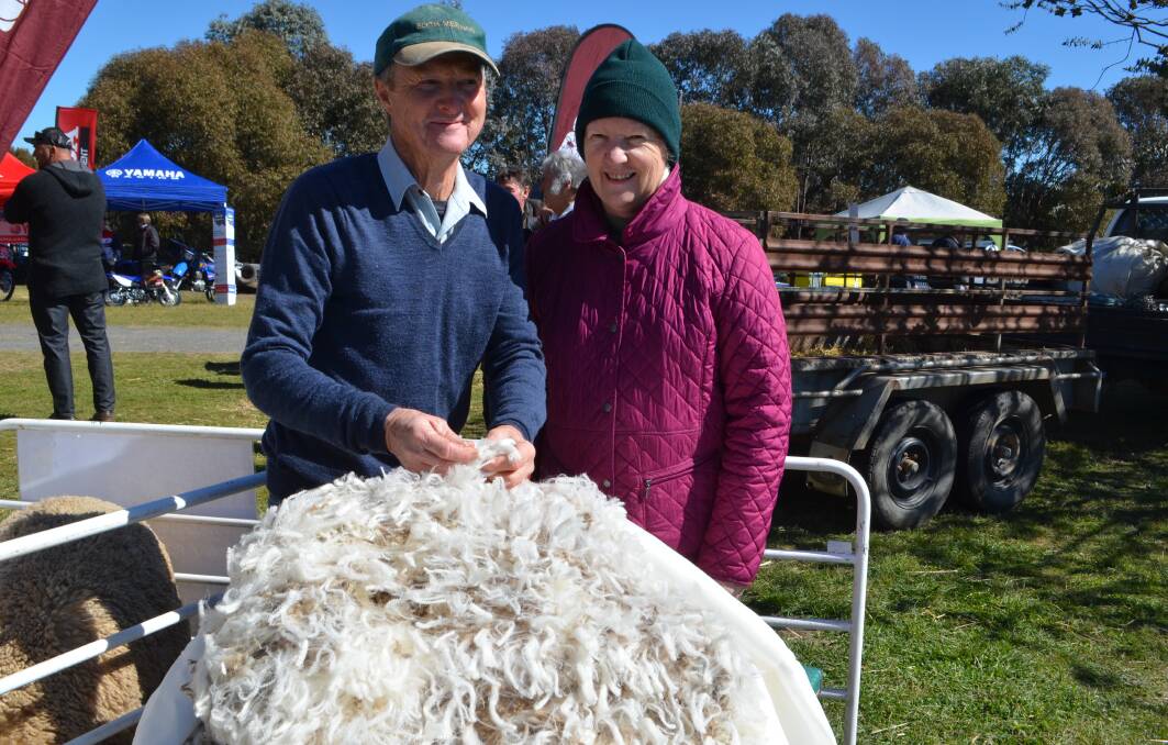 Ron and Cheryl Blyth, Blyth Merinos, Adelong with one of the superb Merino fleeces displayed during the field day. 