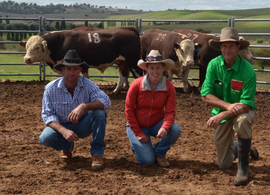 Purchasers Matthew and Hayley Pattison, Deniliquin and Michael Rutherford, Stanford Poll Hereford stud, with the top-priced bull, Stanford Larry L185(P) which sold for $6750.
