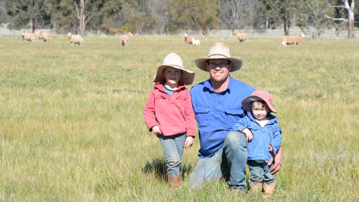 Brothers Lachie, 4, and Archie, 2, pictured with their dad, Spike Orr, "Wilga", who runs a 4500 dual-purpose ewe flock at Parkes. 