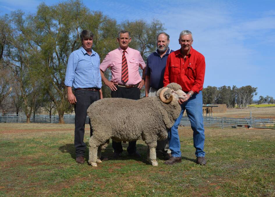 $15,000 sale topper with Garry Cox, Langdene Merinos, Dunedoo; Elders auctioneer Andy McGeoch; purchaser Ken Wolf, Hollowmount Pastoral Company, Bigga, and Hollowmount manager David Zouch. 