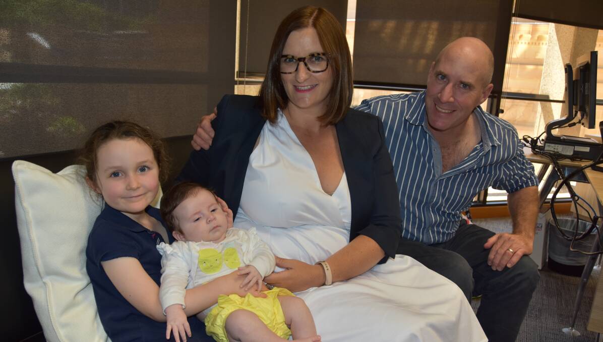 Annabelle, Matilda, Sarah and Anthony Mitchell in NSW parliament house this week. Matilda was born in late November. 