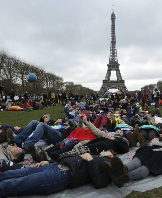 Big crowds gathered at the Paris talks (pictured). Earlier in 2015 NSW Farmers voted to recognise climate change and the need for a managed transition from fossil fuels.