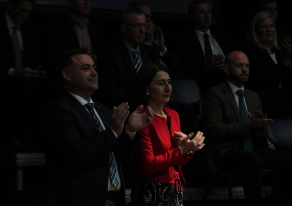 NSW Nationals delegates have voted to ditch the term 'Coalition' for better recognition of the party in government. Pictured is Deputy Premier John Barilaro and Premier Gladys Berejiklian during yesterday's conference proceedings. 