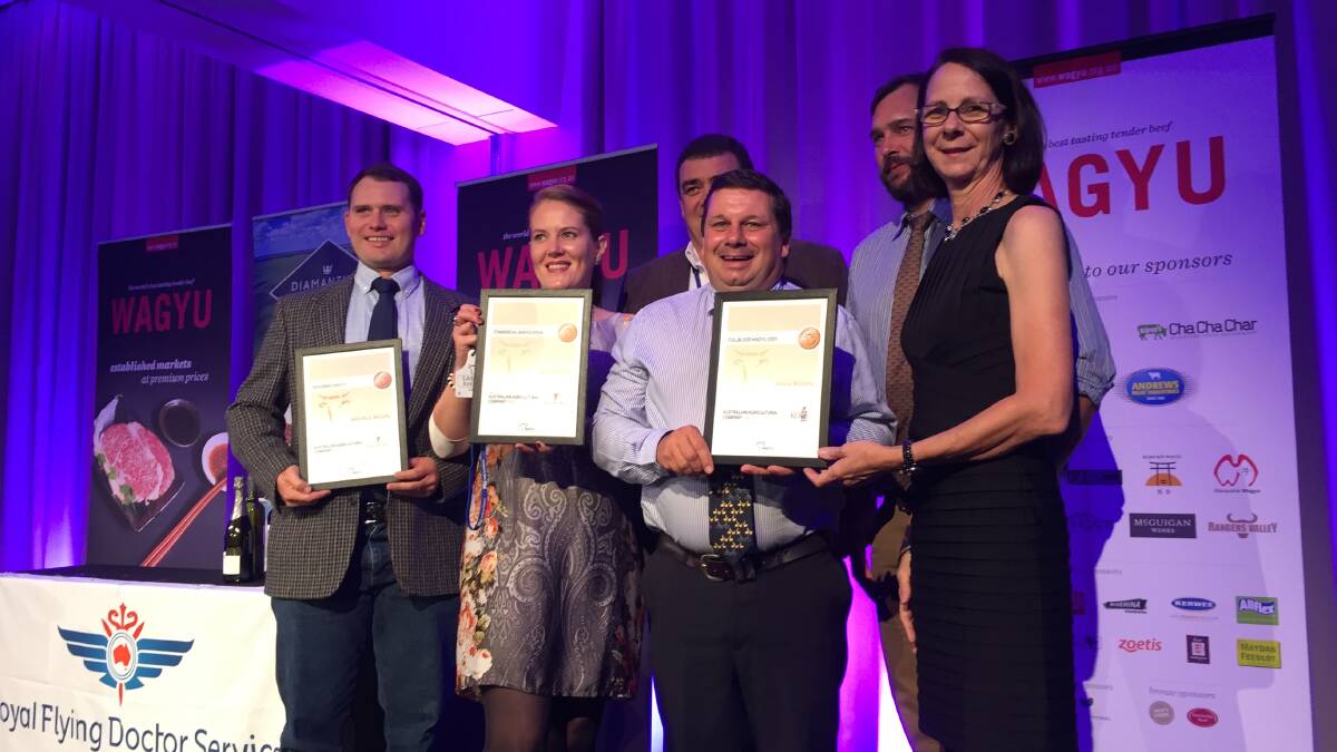 AACo's Marcus Downmany, Sabina Kindler, Jason Strong, Greg Gibbons, David Bailey and Maryanne Gibbons collecting awards for branded beef at the Australian Wagyu Association's conference in the Hunter Valley, NSW, this month.