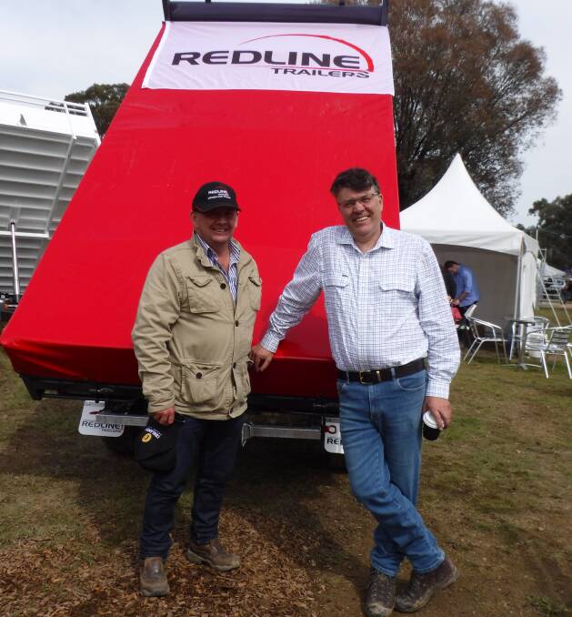 Steve Buchanan from Goondiwindi got the lowdown about Redline Trailers from Lindsay Northcott at the company's display at the Henty Machinery Field Days.