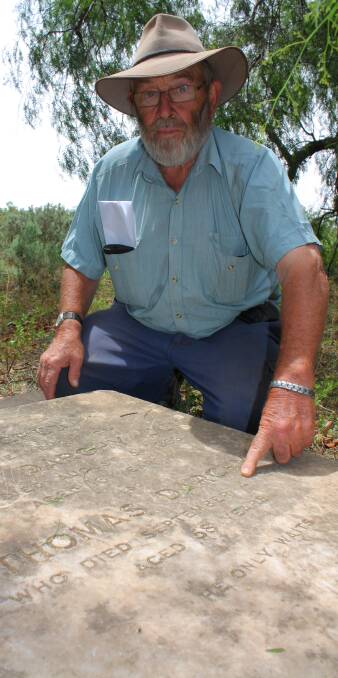 In the dedicated cemetery on Oxley Station, Bob McFarland points out the grave containing the remains of the station’s former owner, Thomas Darchy, who died in 1877.