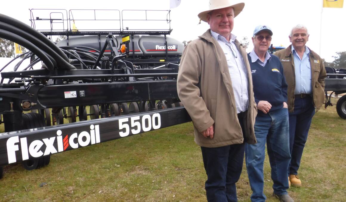 FLEXICOIL Australian brand leader Steve Mulder with Temora Truck and Tractor's Allan Gallagher and Flexicoil territory manager Phil Avery. Croppers at Henty Machinery Field Days were keen to check out Flexicoil's 5500 air drill and 60 series air cart. Contact Flexicoil, 1800 790 811.