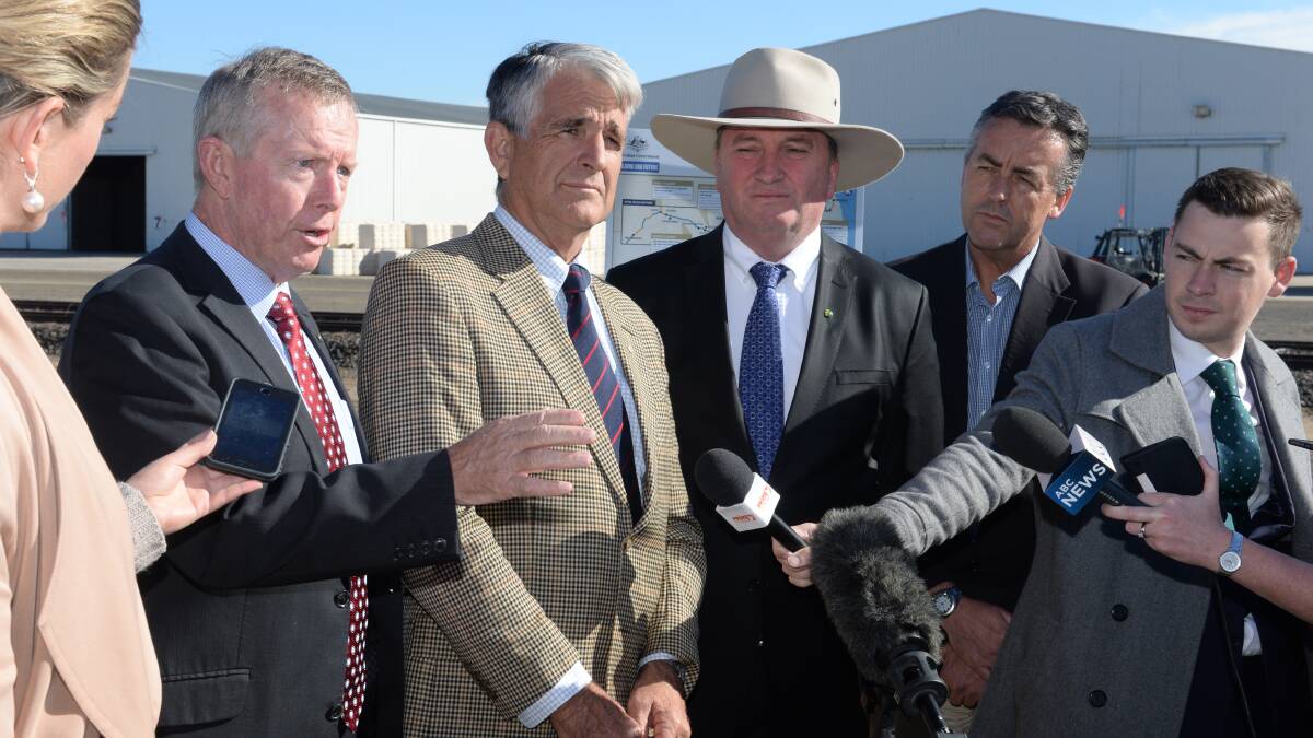 Parkes MP Mark Coulton, Inland Rail Implementation Group committee chairman John Anderson, Agriculture Minister Barnaby Joyce and former Transport Minister Darren Chester gather for the media in May 2016 after the government committed $594 million of its budget to the project.