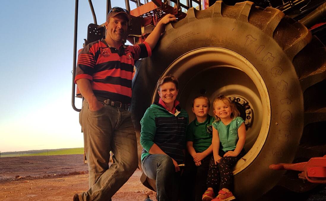 Karen Pollock with husband, Mitch, and daughters Kasey and Jessie,'Mariona', Caragabal, preparing for the clearing sale where auctioneers fees will be donated to cancer research. Photo supplied.