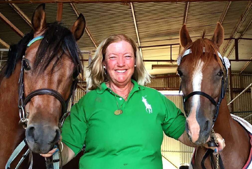 Wendy Hughes from Old Junee with Sienna The Tango on her right and Denhue Royal Design on her left, two of the five horses she is preparing for Royal Sydney Show. 2017 is the 39th consecutive year Wendy has competed with consistent supreme results from the total of 16 hacks, galloways and ponies she has shown in that time. Photo: Pennie Scott
