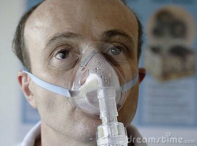 A patient wearing a mask delivering pure oxygen into diseased lungs.Due to the hardening and deterioration of Scott Eppelstun's lungs, he needed to spend many hours each day attached to an oxygen cylinder in order to stay alive. Photo: dreamstock.