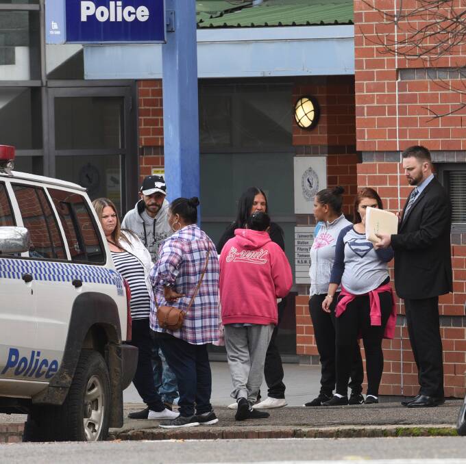 Opening day: Family and friends outside of Tamworth court on Tuesday, including Ralph Murray, pictured back in a hat, who was one of the last people who allegedly saw Johann Morgan alive in 2015. Photo: Gareth Gardner