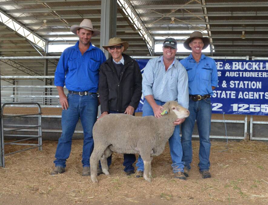 Buyers, Trent and Allan Hall, "Mi-Hi", Gunnedah, stand with Harewood Dohne stud principal Justin Tombs and auctioneer Victor Moar, Armitage and Buckley showcasing the $2300 top-priced ram.