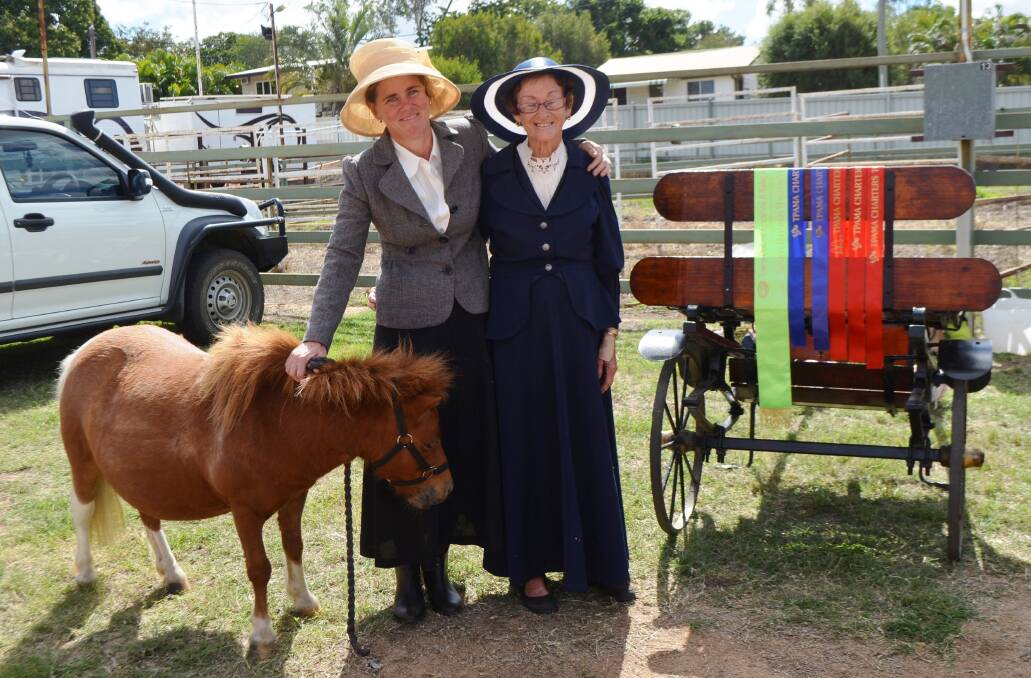 Charters Towers' Kelly Jones and Joan Barrett from Sellheim with Nancy who won six ribbons at the show including Reserve Champion Harness Horse/Pony and the fully restored 1930s wagon that was used in the show.