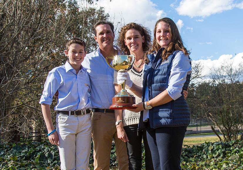 Antony and Katie Thompson (centre) with their son, Sam, 12, and daughter Amy, 14, with the 2017 Melbourne Cup at Widden Stud, Widden Valley.