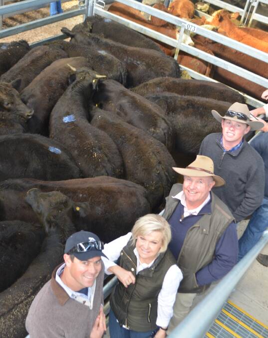 James and Rhonda Daly, Young, with John North, "Bowness", Murringo, and "Bowness" manager, Brent Coster, and 19 Angus-cross steers, sold by Mr North for 399c/kg.