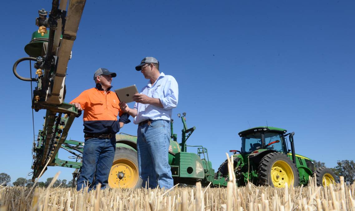Farm manager for Lake Hawdon Props, Paul Tognetti, “Myee”, Grenfell, discusses field mapping with Delta Ag senior agronomist James Ingrey, Grenfell, in a paddock on "Myee".