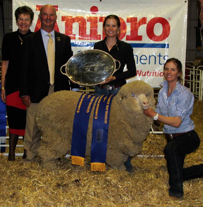 All smiles: Narda, Will and Candice Roberts and Catherine Perrett proudly displaying the Queensland Ewe of the Year. Picture: Sally Cripps.