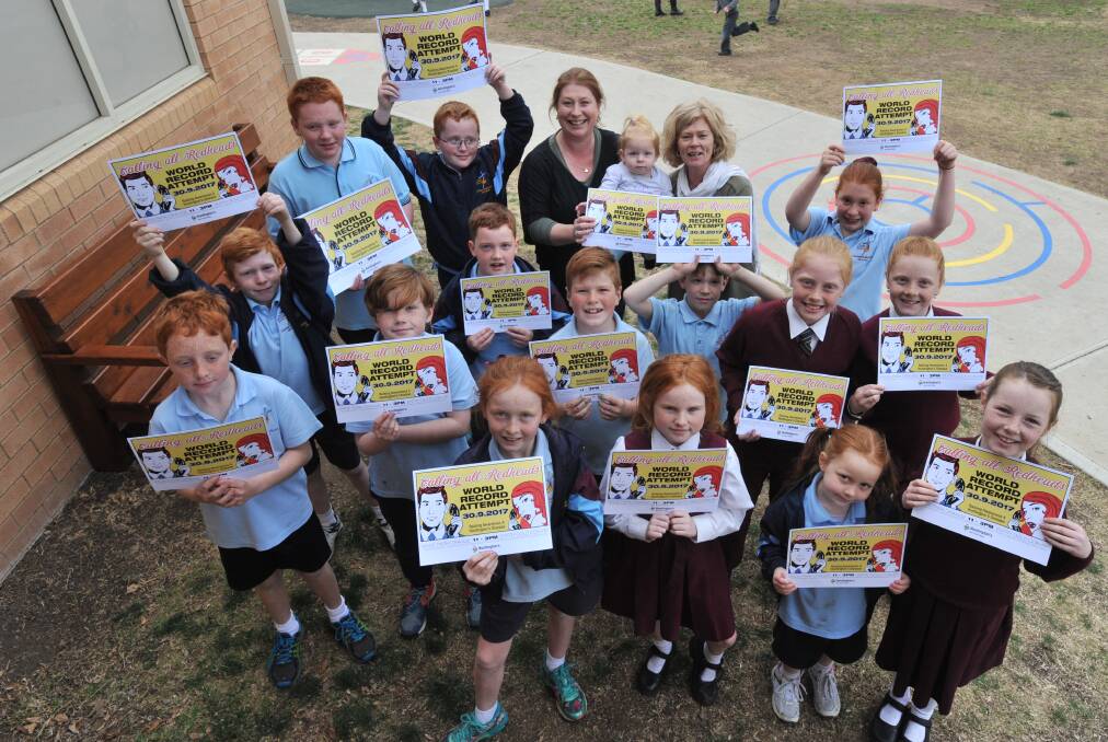 REDDY: Redheads at Catherine MacAuley primary school promote the event.