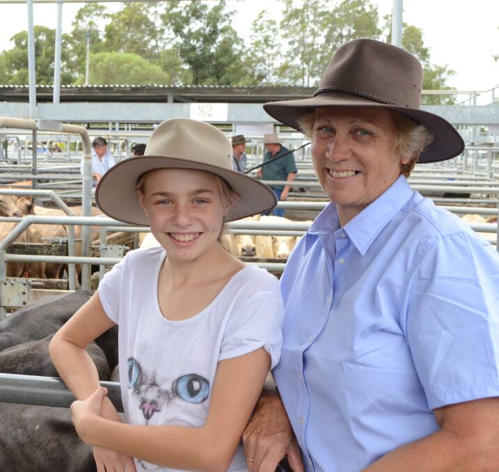 Margo Duncan, "Balickera", East Seaham, and her granddaughter Emelia Lieb, with Angus cattle at the Maitland saleyards.