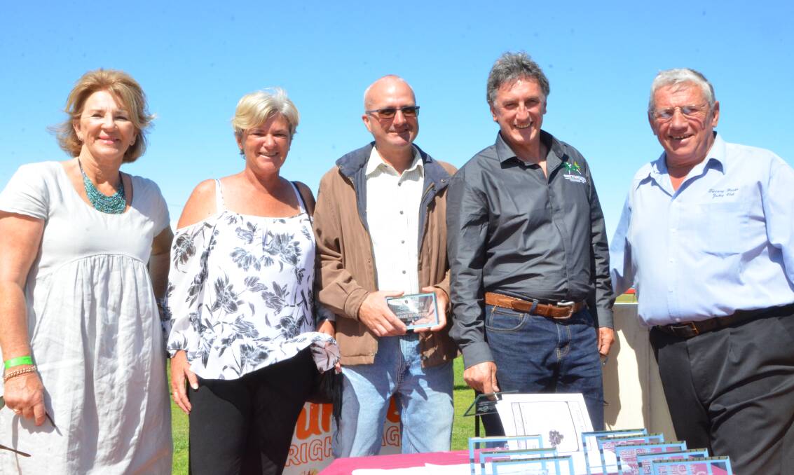 Connections of Arise Augustus including Julie Ahlstrom, Sandie Lowndes, John French, trainer Terry Evans, accepting trophies from Tuncurry Forster Jockey Club president Garry McQuillan.