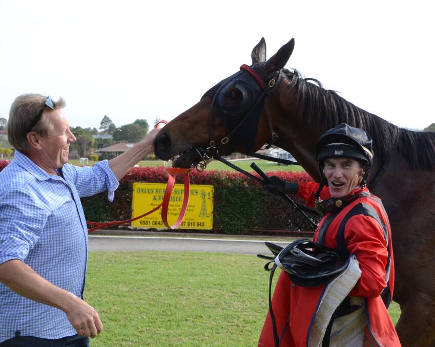 Cessnock trainer Jeremy Sylvester with Collar and jockey Robert Thompson after a win in the Fastplast Building Supplies Open Handicap.