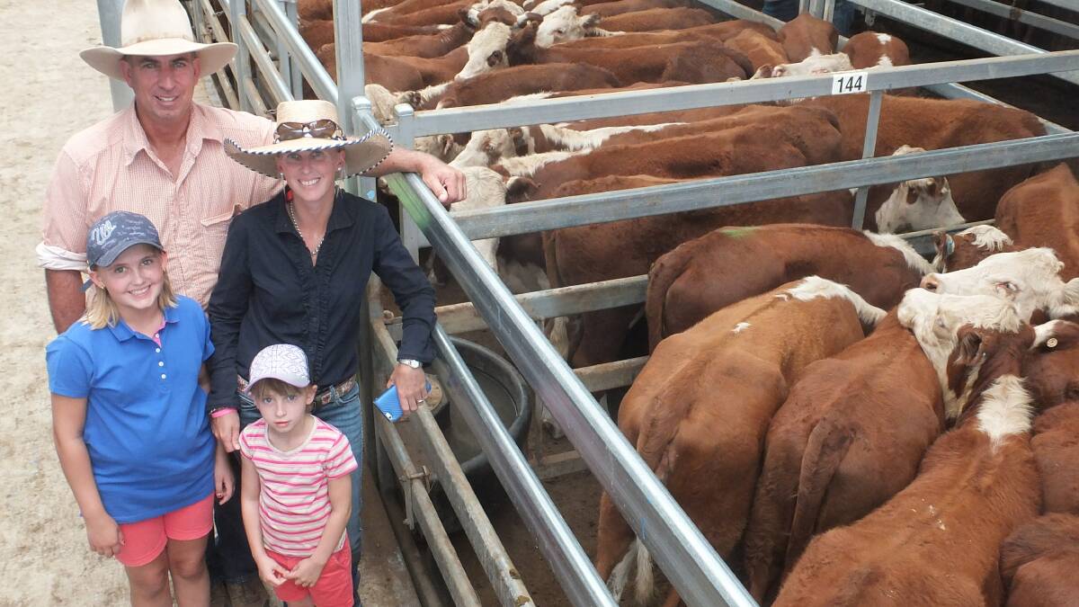 North Territory vendors Steve and Rebecca Cadzow and their daughters Bridgette, 10, and Imogen, 6, with some of their cattle.