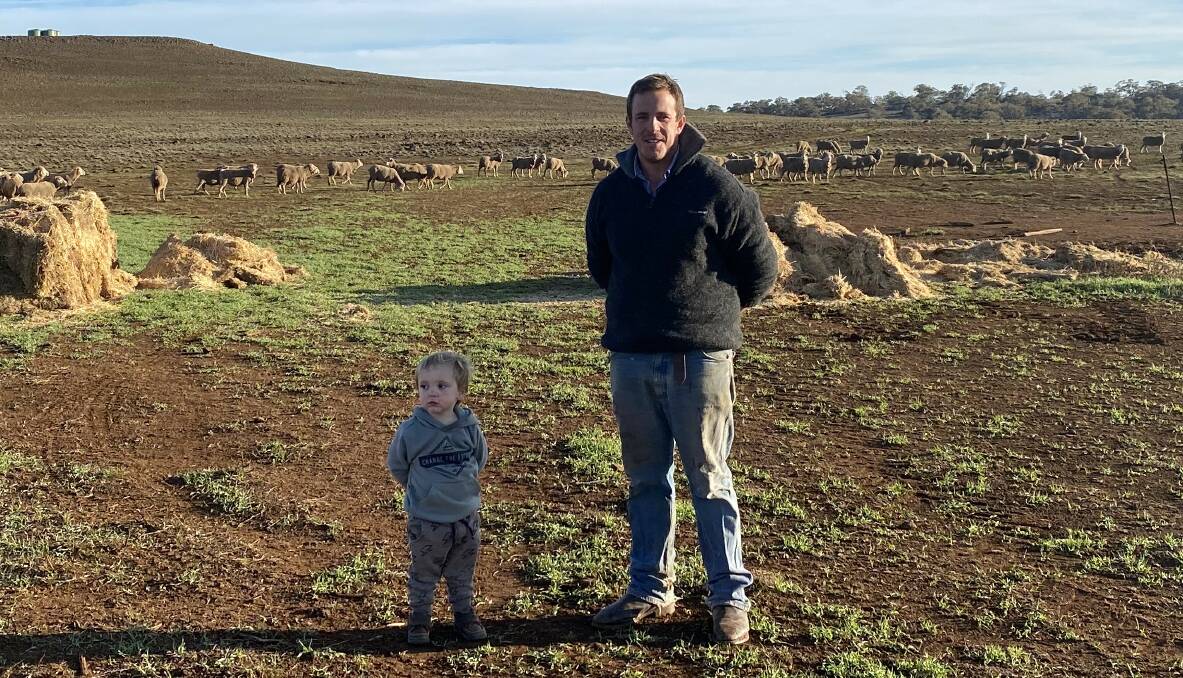 MOVING TO BREEDING: Andrew Rolfe,with son Jack, at Kenilworth, between Nimmitabel and Dalgety. The Rolfe family was previously running wethers, but now has 6000 ewes.