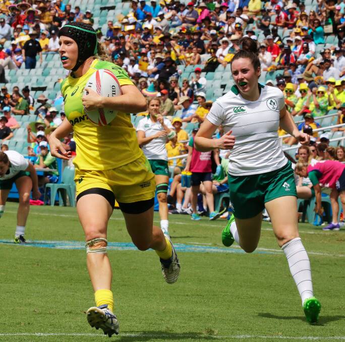 Gemma Etheridge playing rugby for Australia against Ireland.
