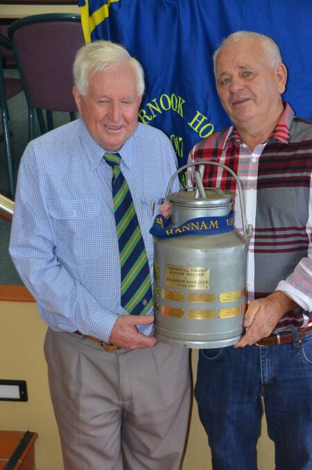The Hannam Vale Cup trophy - a milk can - held by Les Cross and Peter Killen. 