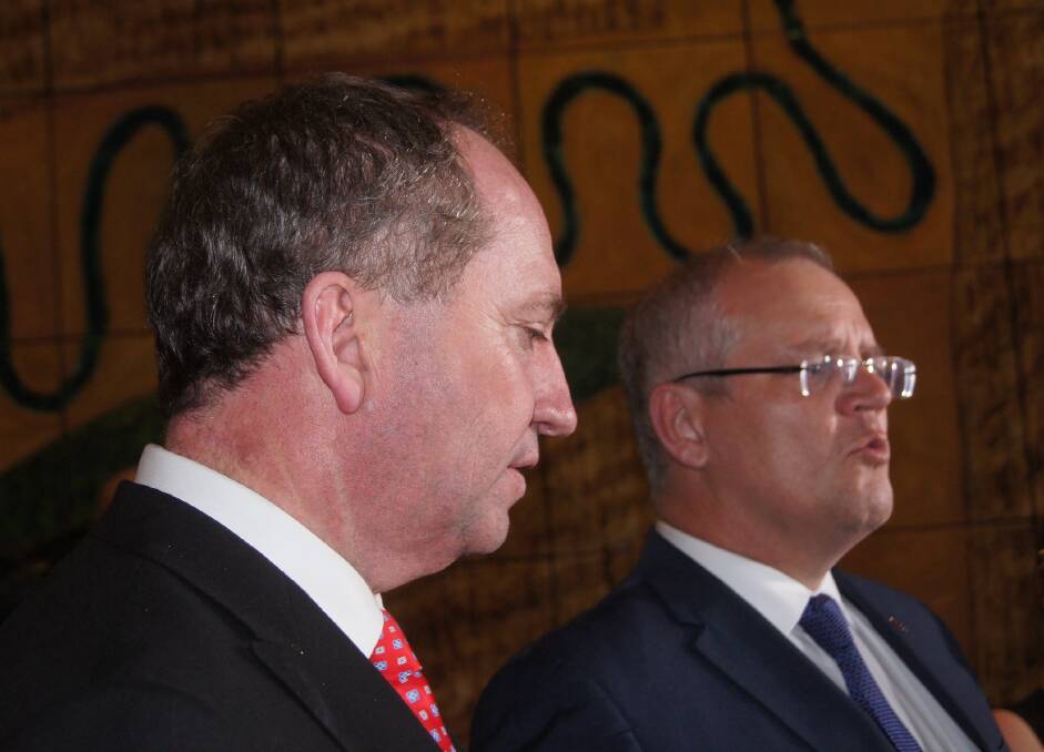 Treasurer Scott Morrison (right) and Agriculture and Water Resources Minister Barnaby Joyce facing media in Canberra tonight.
