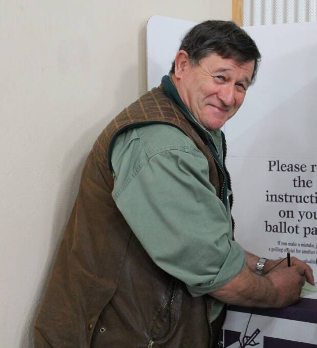 Former Shadow Agriculture Minister John Cobb voting at the 2013 election but is not retunring to Canberra after this year's poll.