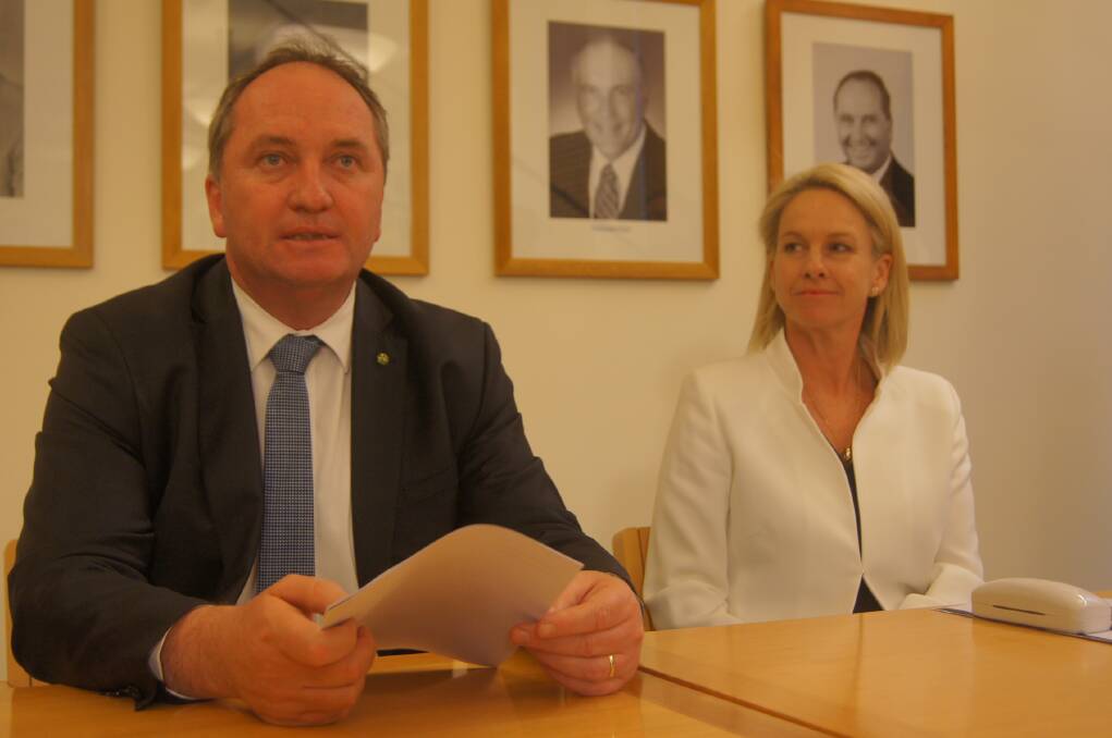 Deputy Prime Minister Barnaby Joyce and Nationals deputy-leader Fiona Nash addressing their party room meeting yesterday in Canberra.