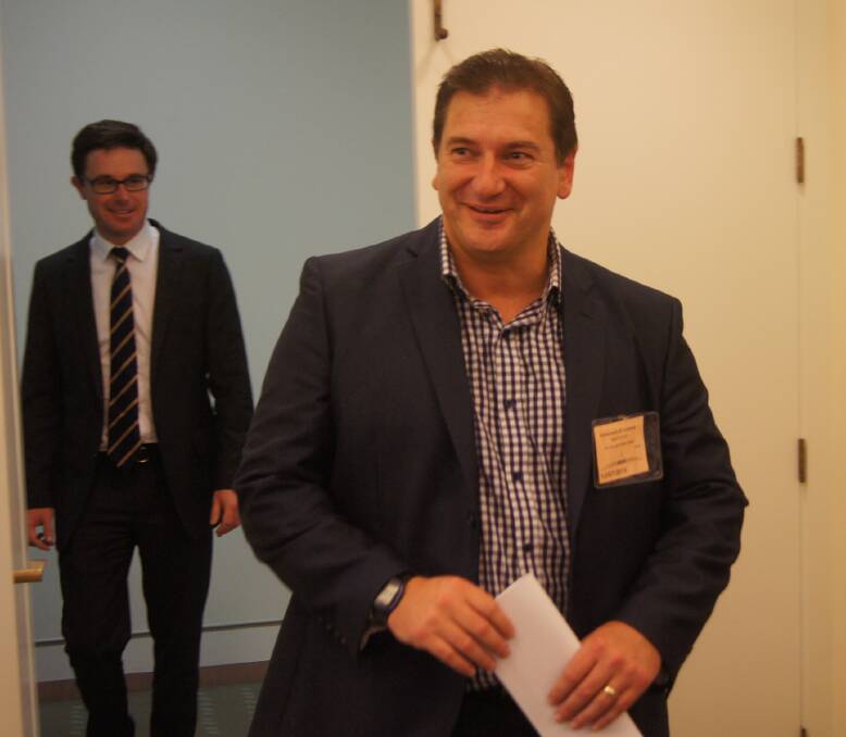 New Wide Bay MP Llew O'Brien enters the Nationals party-room for the first time followed by newly elected Maranoa MP David Littleproud.