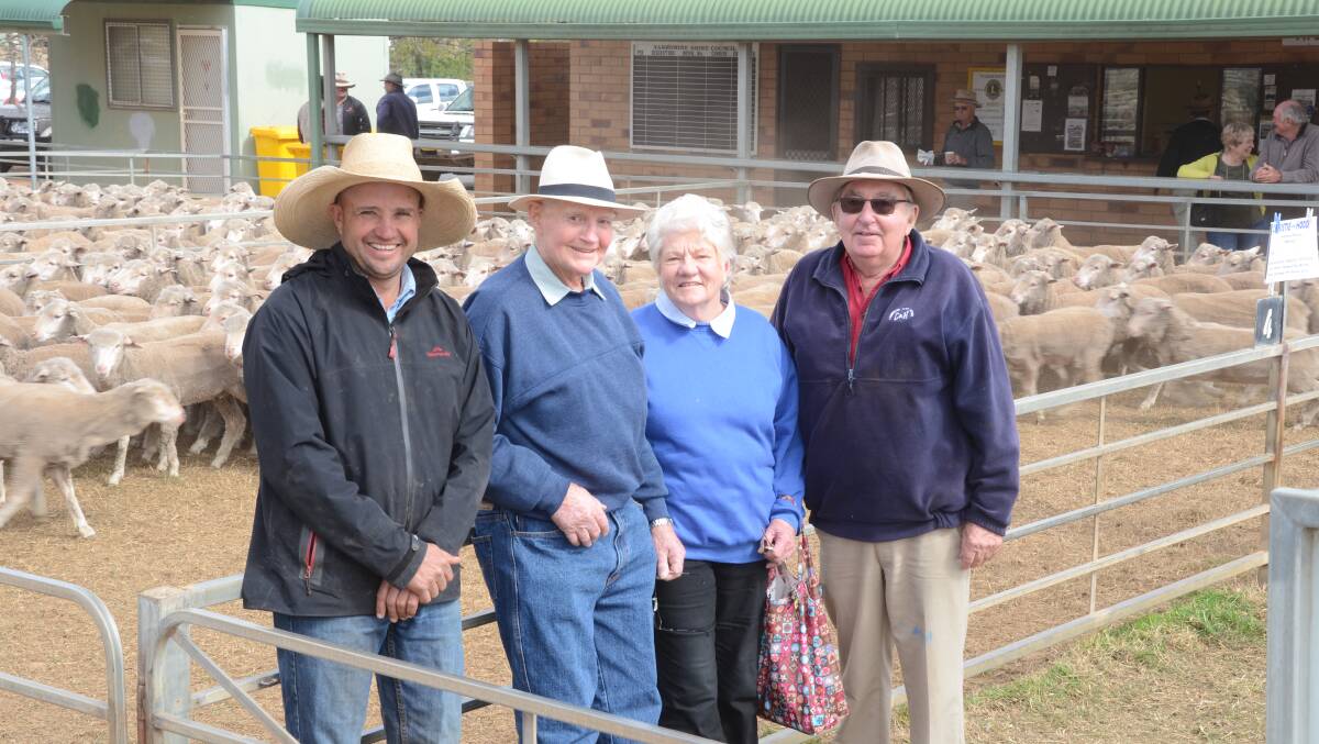 Tim Wiggins, Christie and Hood, Narromine, with Kevin and Rose Marie Perry, “Rothsay”, Quambone, and Colin Hood, Dubbo. The Perrys bred and sold the $185 top-priced Merino ewes.