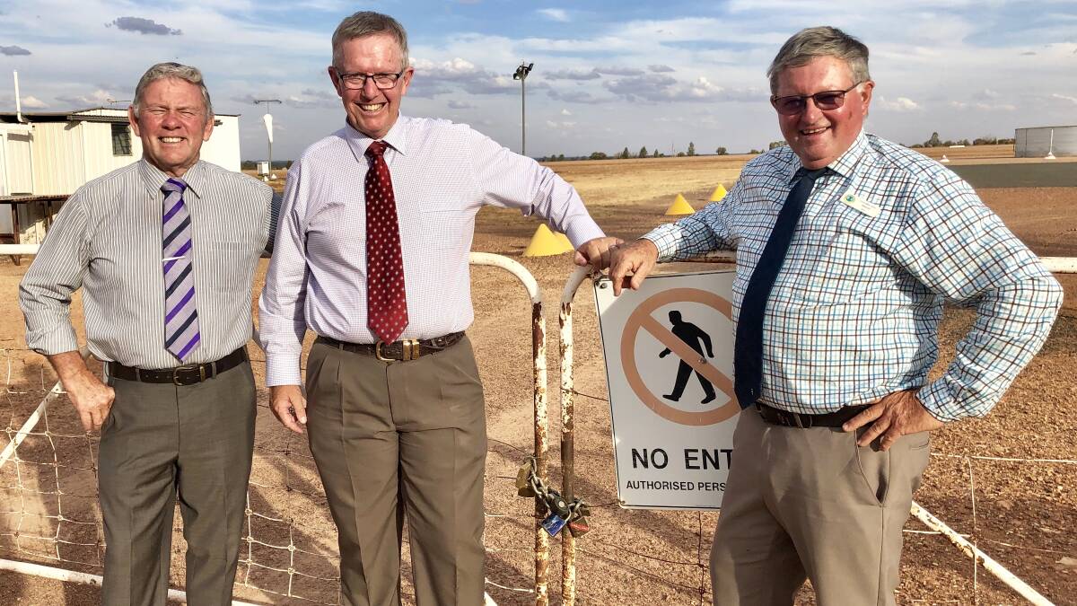 Lachlan Shire Council deputy mayor Paul Phillips, Mark Coulton, and mayor John Medcalf at the Lake Cargelligo airstrip in March 2019.